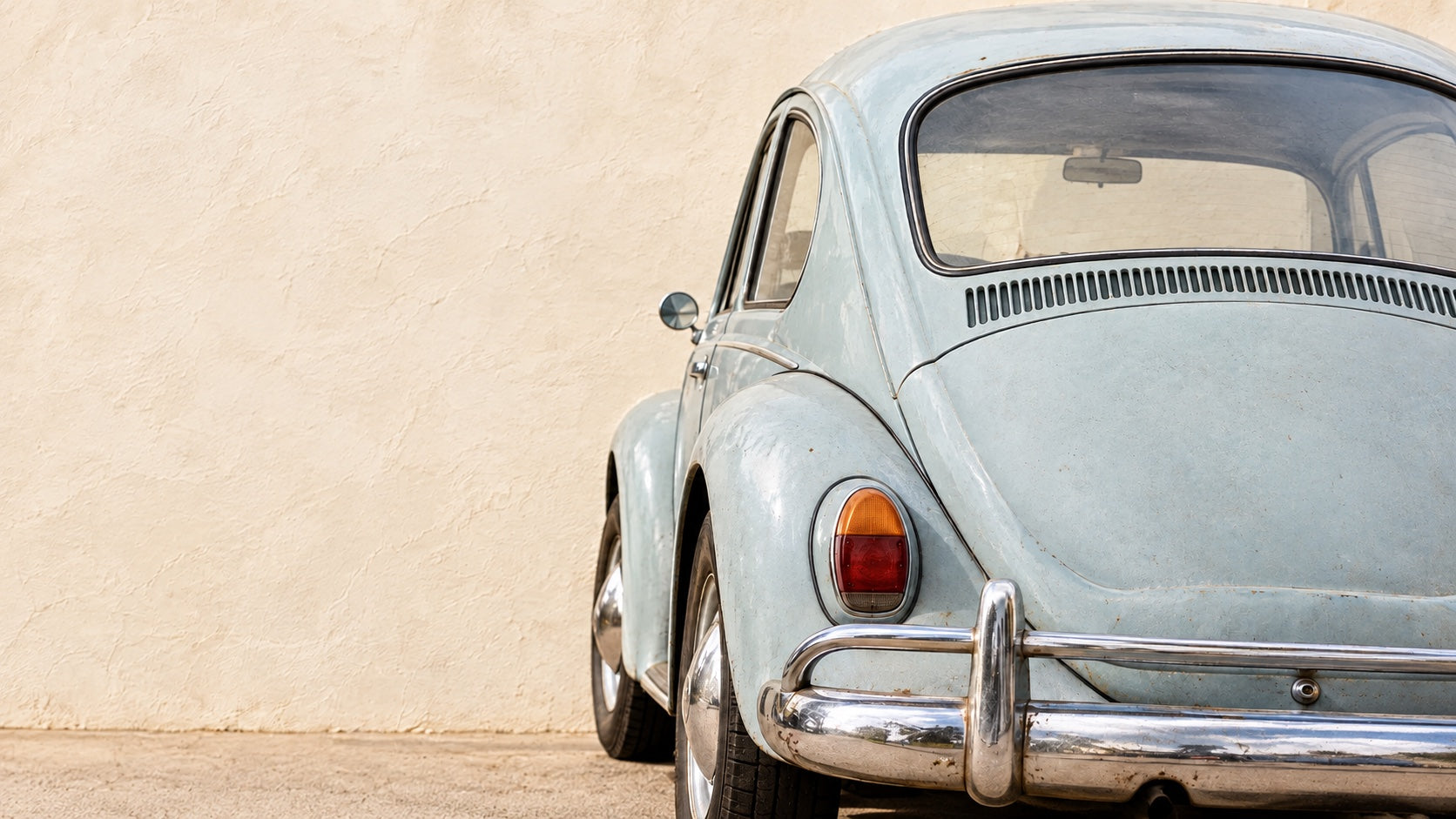 The back of an old Beetle with the studio's stickers on it